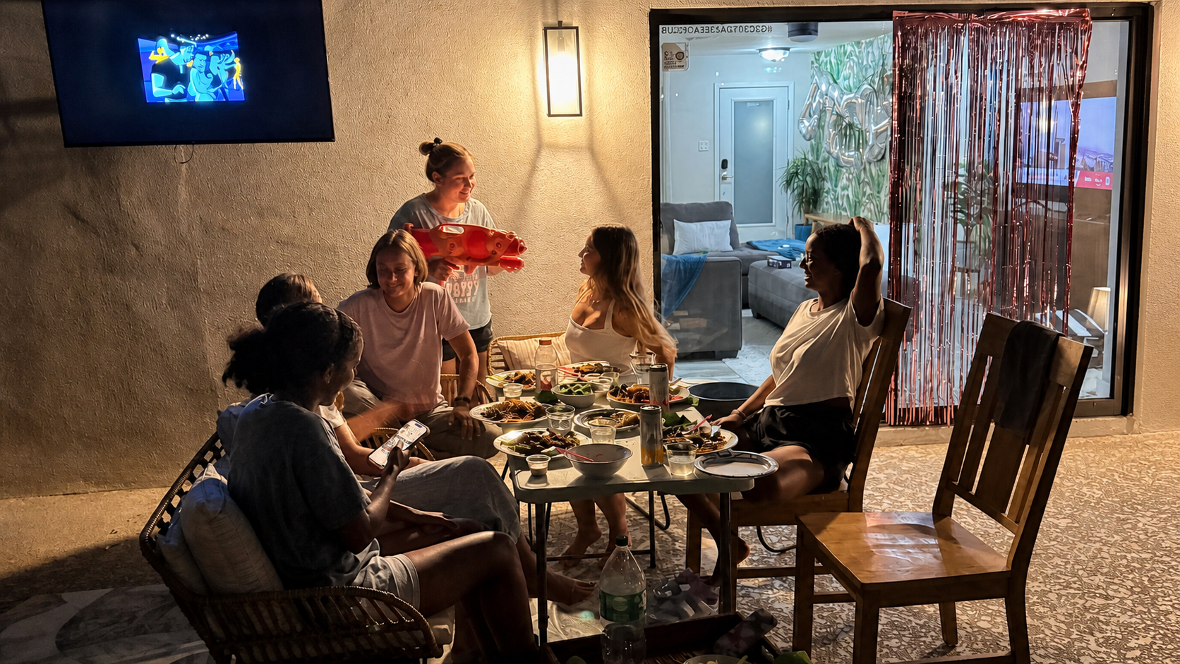 Family and friends sharing a private patio hibachi dinner in Mesa