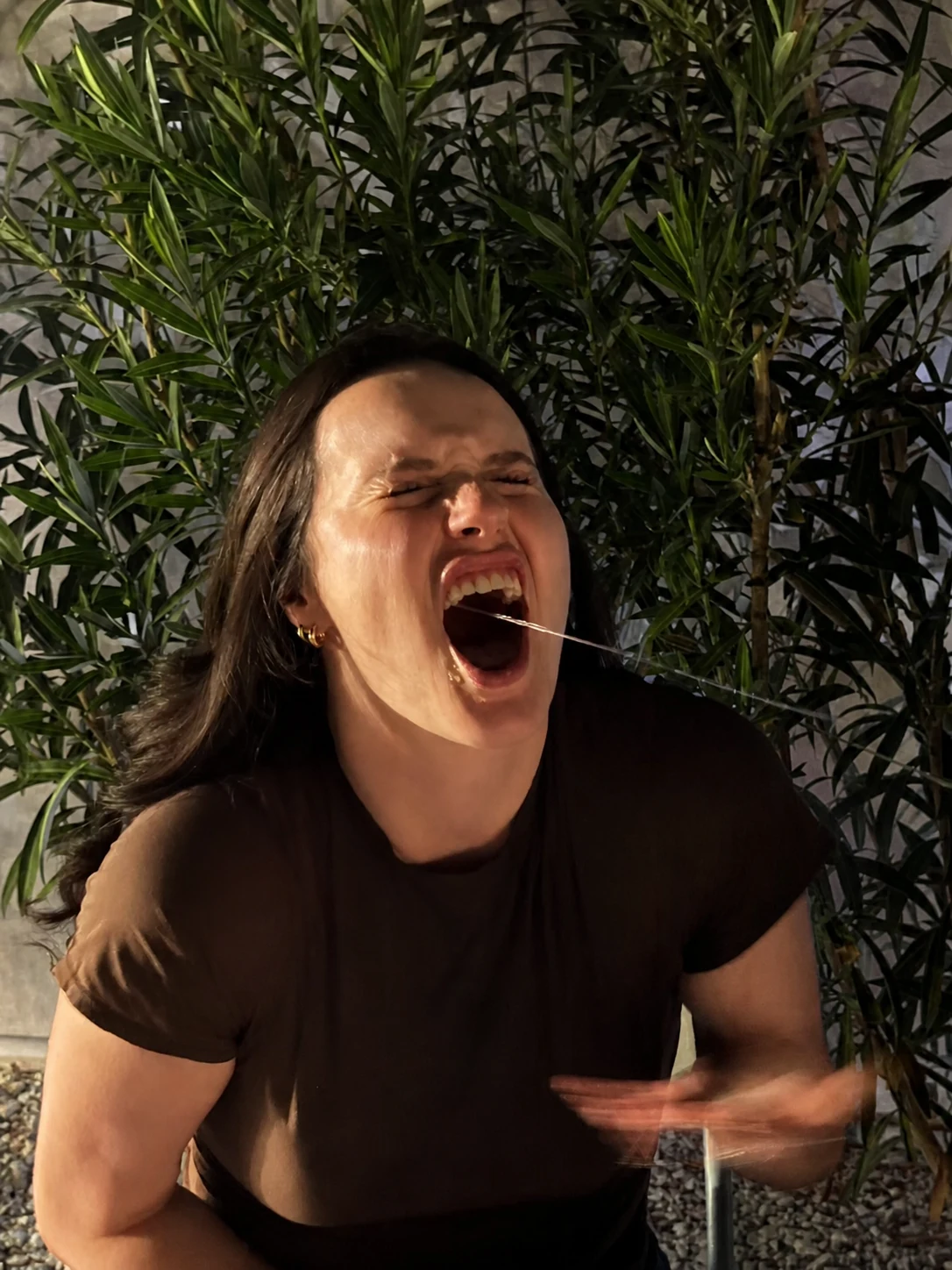 Guest laughing during the sake stream hibachi game