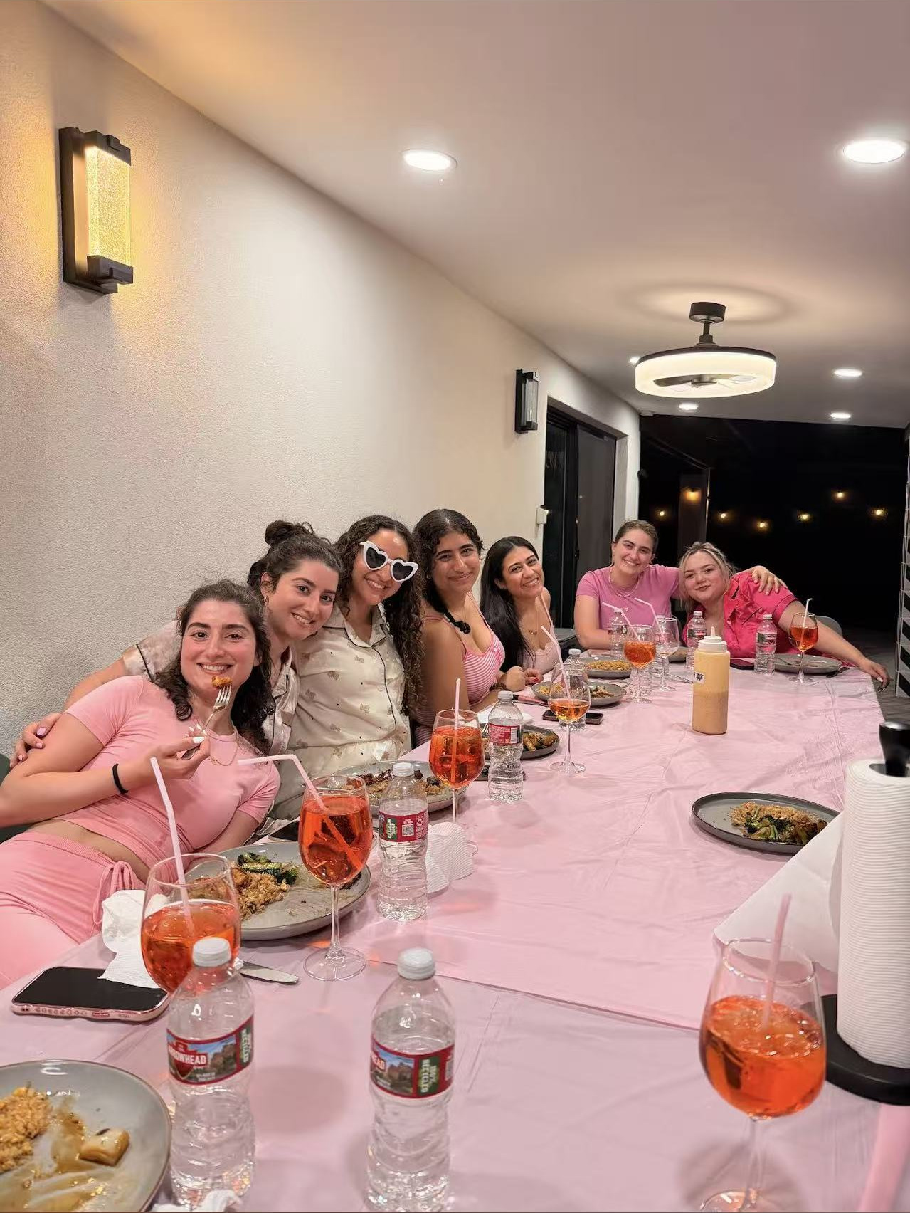 Guests celebrating together at a pink hibachi dinner table