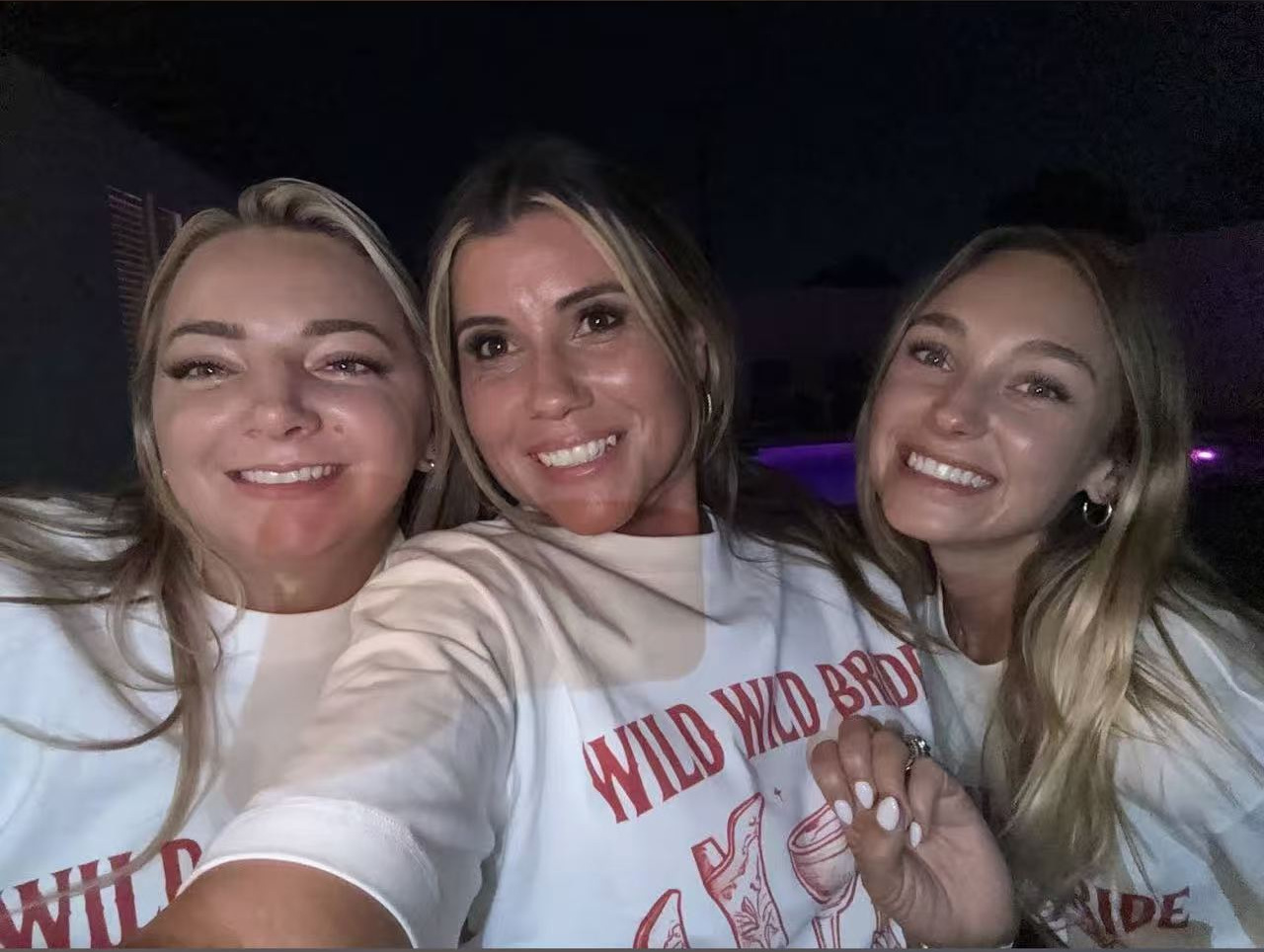 Three guests taking a selfie during a bachelorette celebration